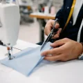 close-up-of-production-line-worker-cutting-fabric-PZW4NBZ-1024x683