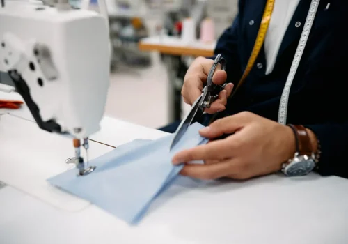 close-up-of-production-line-worker-cutting-fabric-PZW4NBZ-1024x683